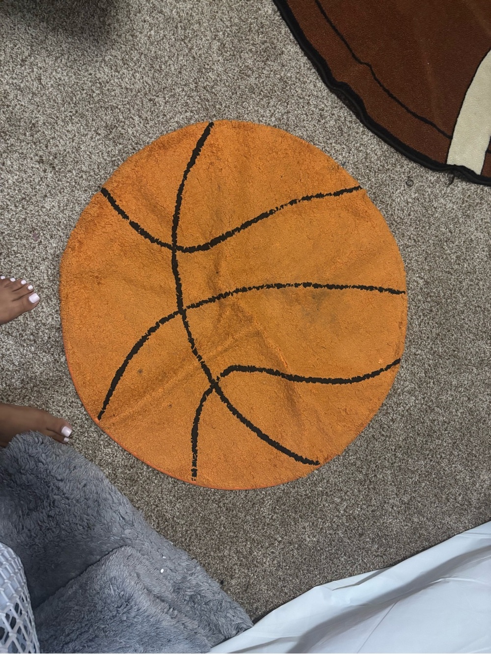 Hobby Lobby Orange Basketball Shaped Rug with Black Lines